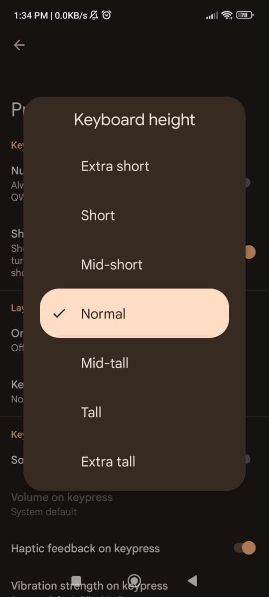 Tap on Keyboard height and select Normal from the list