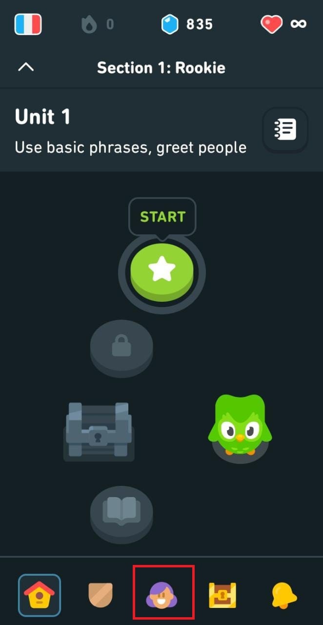 Open the Duolingo app and tap on the face icon at the bottom of the screen.